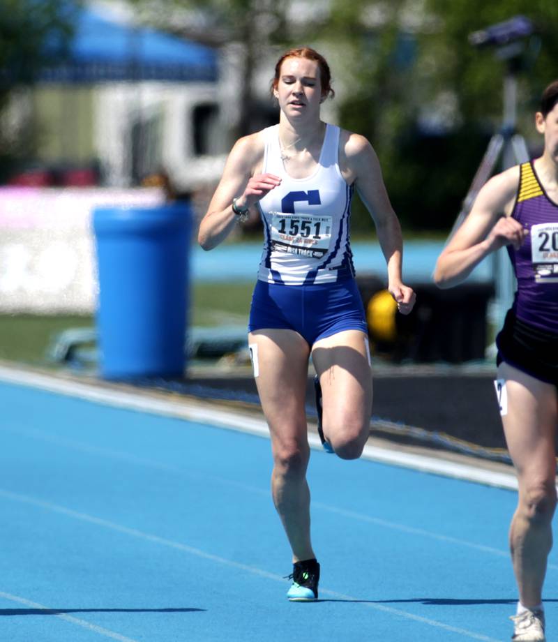 Burlington Central’s Paige Greenhagle (center) competes in the 2A 400-meter dash during the IHSA State Track and Field Finals at Eastern Illinois University in Charleston on Saturday, May 20, 2023.