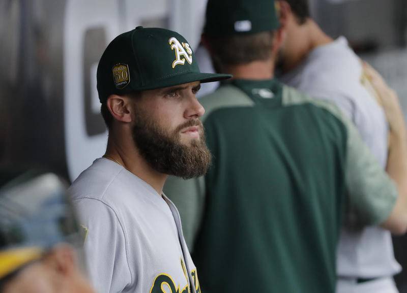 Nick Martini looks out at the field from the dugout during the seventh inning Saturday against the White Sox at Guaranteed Rate Field.