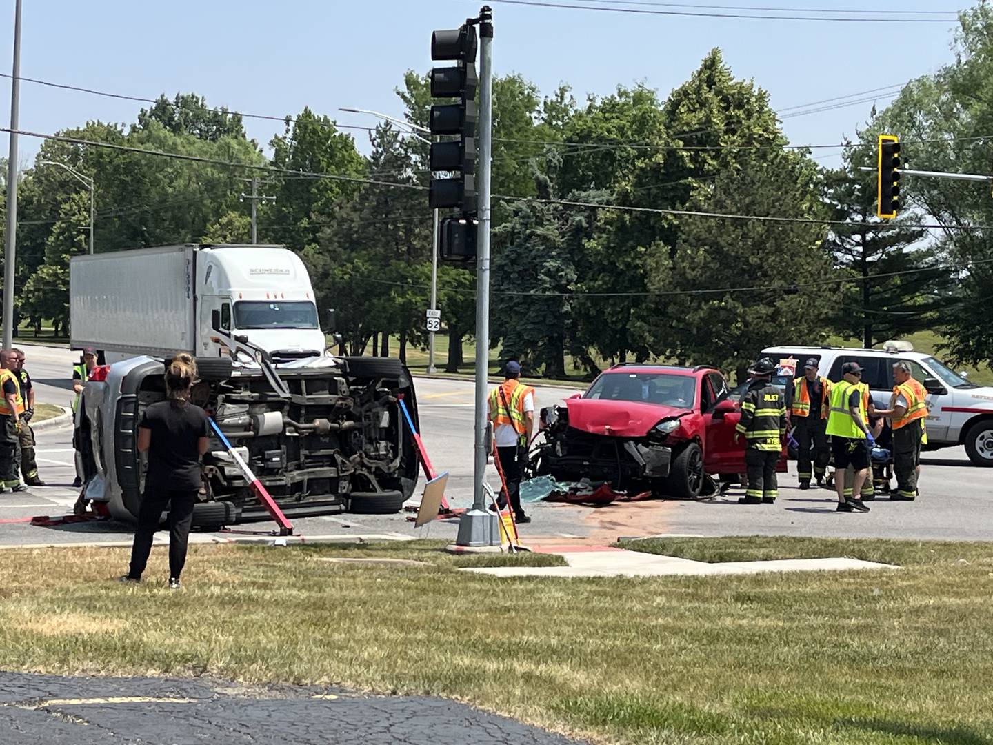 Emergency crew respond to a crash at the intersection of Essington and Jefferson streets on Tuesday, June 20, 2023 in Joliet.