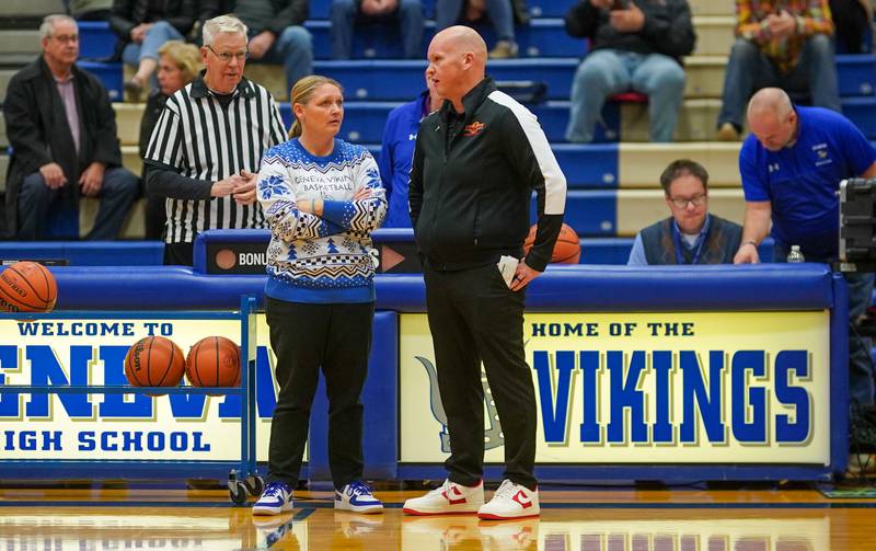 Geneva’s head coach Sarah Meadows talks to Batavia’s head coach Kevin Jensen before tip-off of their basketball game at Geneva High School on Friday, Dec 15, 2023.