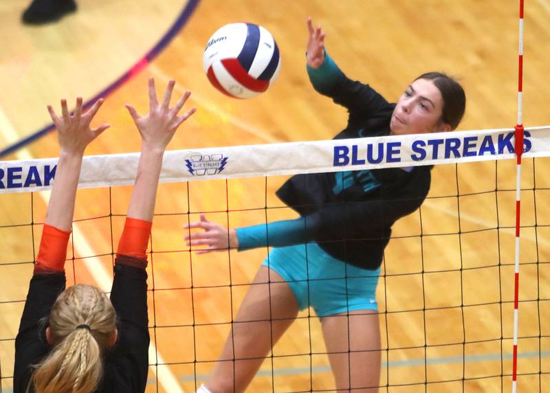 Woodstock North’s Jenna Johnson hammers the ball against Crystal Lake Central in IHSA girls volleyball Class 3A Regional action at Woodstock High School in Woodstock on Thursday, October 30, 2025.