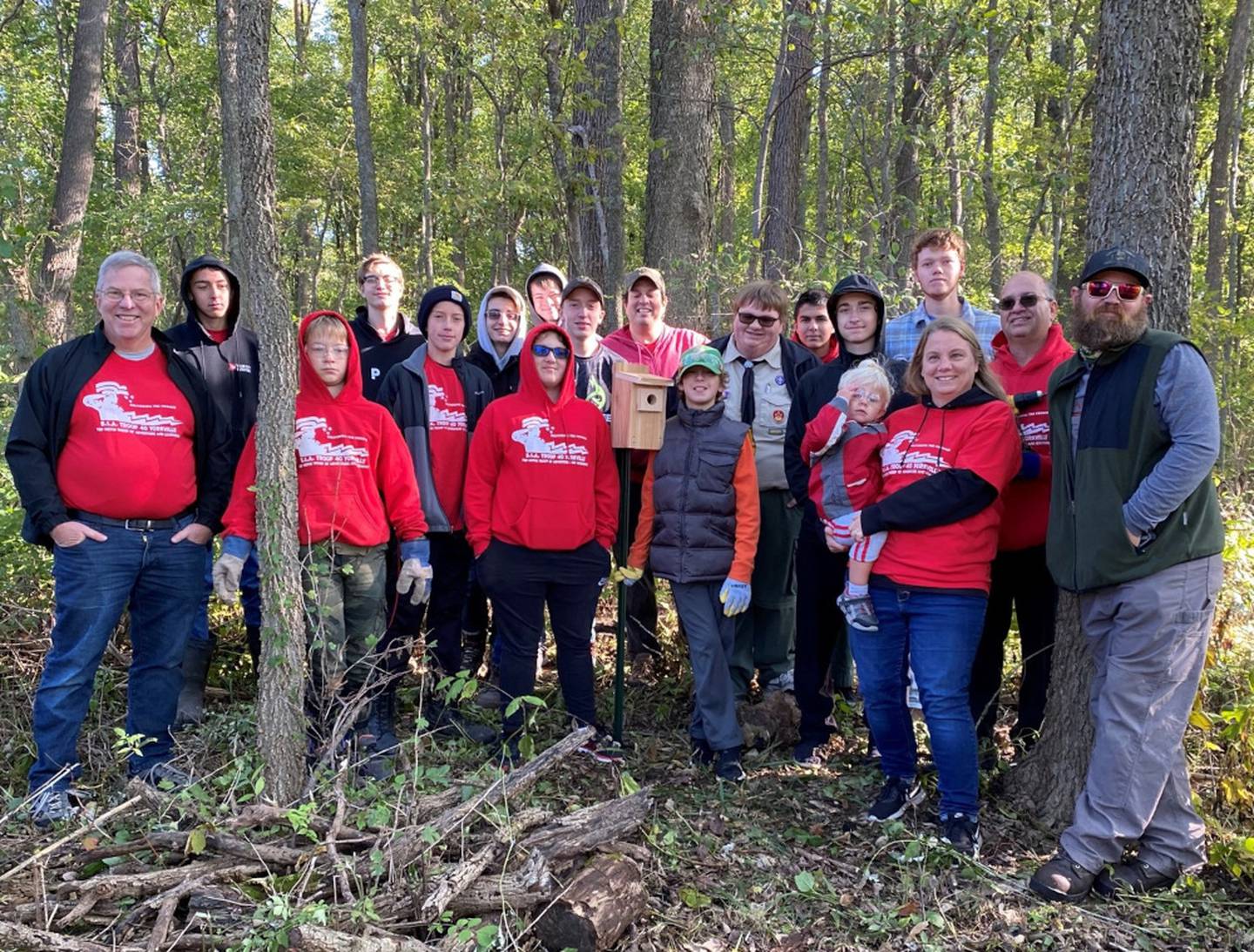 Troop 40 Eagle Scout Kirkman Harding, center right in uniform, stands with his crew who helped complete 18 Bluebird boxes for his Eagle Scout Leadership Project at Sannauk Forest Preserve.