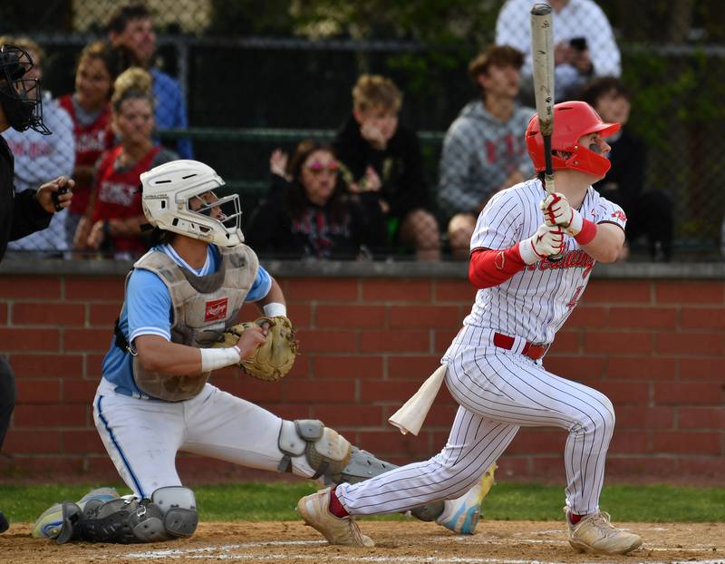 Benet's Jeremy DeWilkins watches his long fly to the gap in left center filed that was caught for an out during a game against Nazareth on April 22, 2024 at Benet Academy in Lisle.