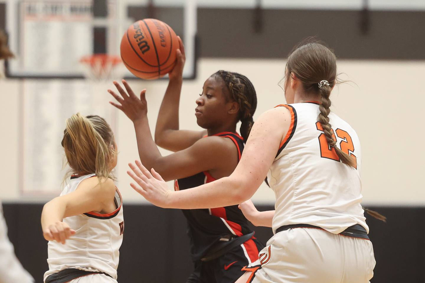 Lincoln-Way Central’s Kiya Newson-Cole passes out of double coverage against Lincoln-Way West on Monday, Jan. 22nd, 2024 in New Lenox.