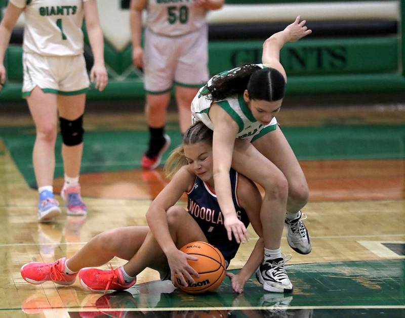 Alden-Hebron's Nathalia Mendoza crashes over Woodlands Academy's Emma O'Brien as the go for a loose ball during a nononference girls basketball game on Thursday, Jan. 29, 2026, at Alden-Hebron High School in Hebron.