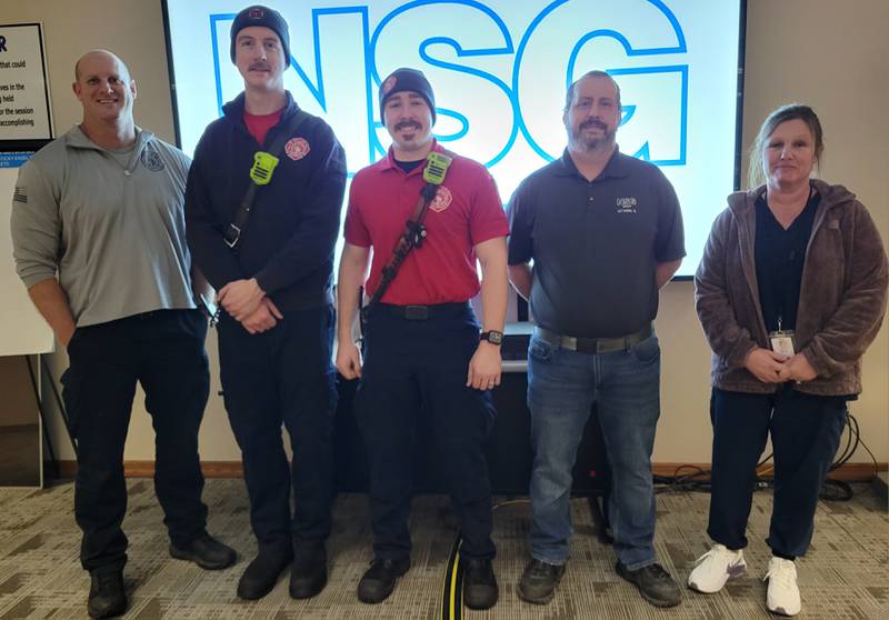 Quick thinking by Pilkington North America employees Becky DePue and John Baldwin (from right) saved the life of their coworker Guy Ludwig from a heart attack last month. Also responding that day were (from left) Ottawa Fire Department Capt. Kevin Theis and firefighter/paramedics James McGuire and Caleb Beck.