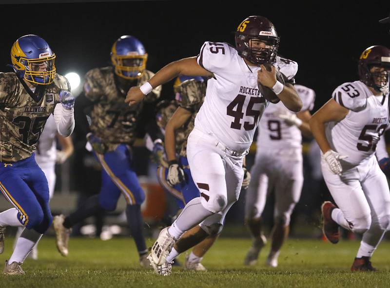 Richmond-Burton's Braxtin Nellessen runs away from the Johnsburg defense during a Kishwaukee River Conference football game on Friday, Oct.6, 2023, at Johnsburg High School.