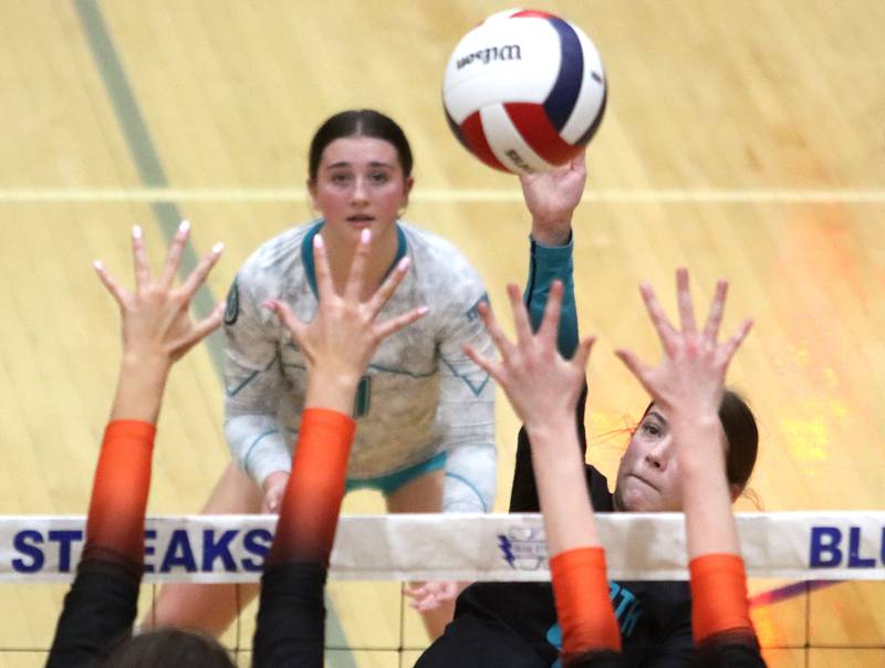 Woodstock North’s Jenna Johnson tips the ball against Crystal Lake Central in IHSA girls volleyball Class 3A Regional action at Woodstock High School in Woodstock on Thursday, October 30, 2025.