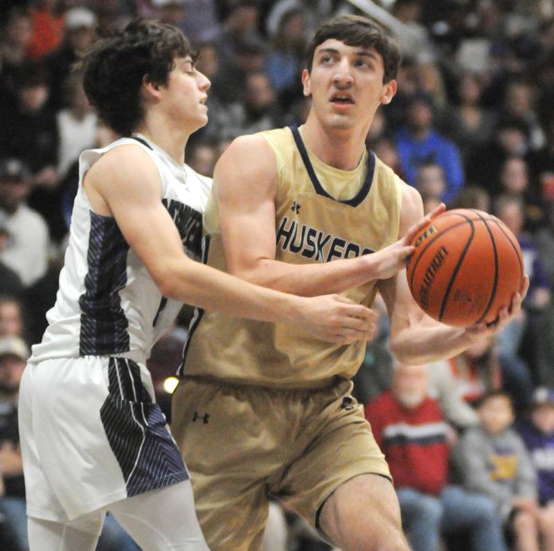 Serena's Richie Armour eyes the basket as Lexington's Blaine Friedmansky defends in the Marquette Christmas Tournament championship game on Friday, Dec. 28, 2023.