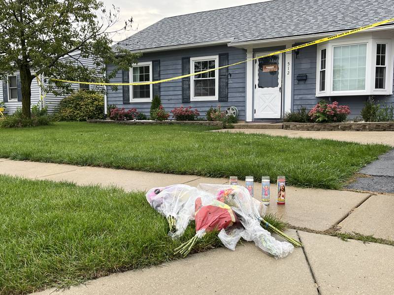 A small memorial of candles and flowers seen on Tuesday, Sept. 19, 2023, in front of the residence in the 500 block of Concord Avenue in Romeoville. On Sunday, Sept. 17, officers discovered the bodies of Alberto Rolon, 38, Zoraida Bartolomei, 32, and their two sons, ages 7 and 9, inside the residence. Police are investigating their deaths as homicides.