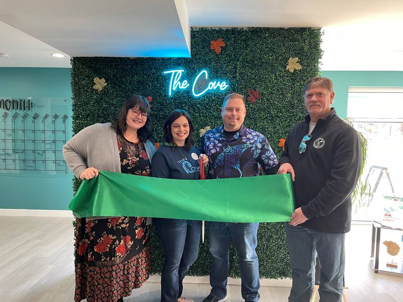 Laura and Tyler Jones, owners of The Cove, 30 N. Broadway St. in Coal City, cut the ribbon with Coal City Mayor Terry Halliday and Grundy County Chamber Events and Marketing Director Amanda Hiller during a ceremony on Nov. 23. The Cove is a nutrition club offering beverages for health and wellness.