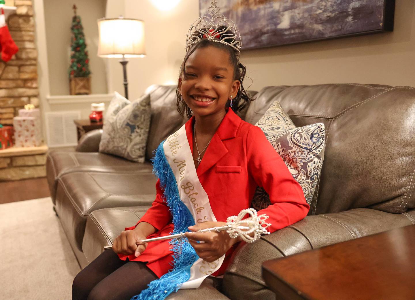 Reyna Slater, age 7, who recently won the 2023 Little Miss Black Joliet poses for a photo on Tuesday, Dec 5, 2023. The pageant was an annual event until 2008 and was revived this year