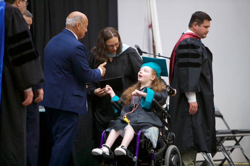 Aurora Murphy receives her diploma at Woodstock North's Graduation Ceremony on Saturday, May 13, 2023 in Woodstock.