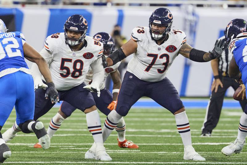 Chicago Bears offensive tackle Darnell Wright (58) and guard Jonah Jackson (73) block against the Detroit Lions during an NFL football game in Detroit, Sunday, Sept. 14, 2025. (AP Photo/Rick Osentoski)