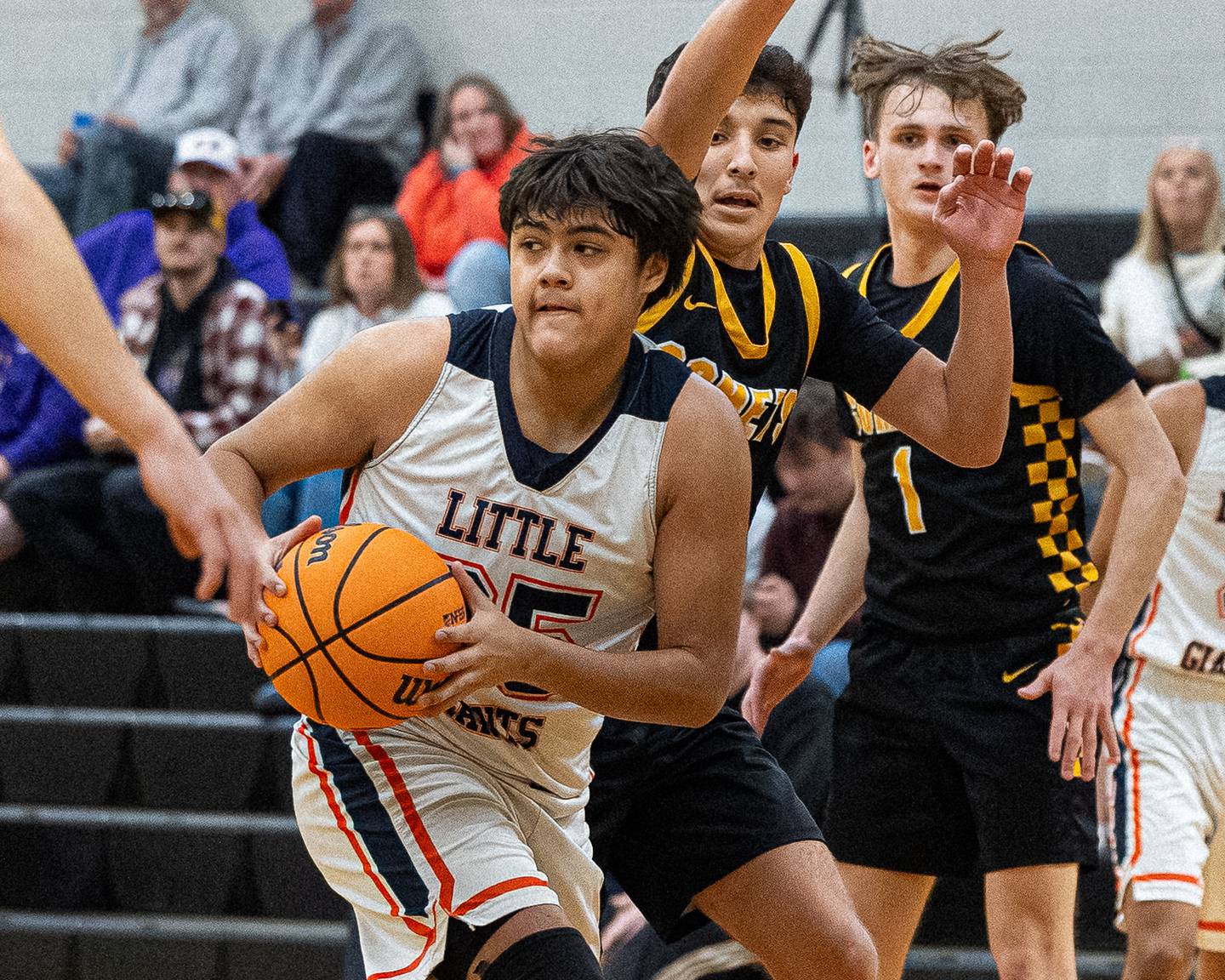 Sebastian Godinez (25) of DePue looks for open teammate for pass during game against Reed-Custer during game in the Shipyard Showdown on Tuesday, December 23, 2025 at Seneca High School in Seneca.