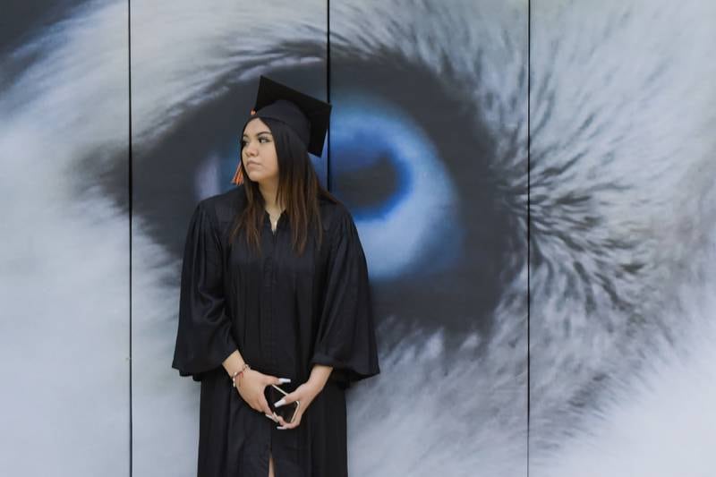 Jasmine Mendez has an “eye” on her future as she waits for the start of the DeKalb High School graduation ceremony at the Convocation Center in DeKalb on Saturday, May 28, 2022.