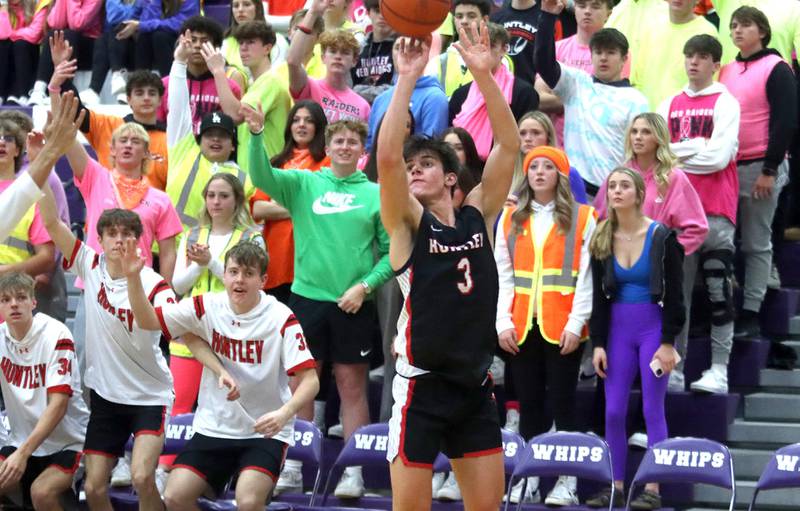 Huntley’s Ty Goodrich takes an outside shot in boys basketball at Hampshire on Friday.