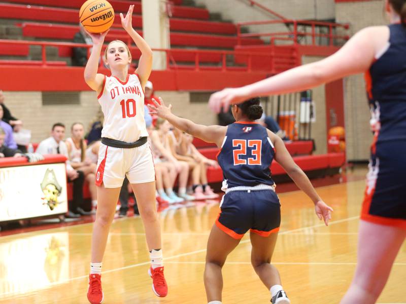Ottawa's Ella Schmitz shoots a jump shot over Pontiac's Araceli Serna during the Ottawa Girls Holiday Tournament on Monday, Dec. 16, 2024 in Kingman Gym at Ottawa High School.