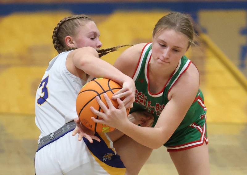 Somonauk-Leland's Macey Kinne (left) and La Salle-Peru's Ella McCauley fight for possession during their game Thursday, Nov. 20, 2025, in the Tim Humes Breakout girls basketball tournament at Somonauk High School.