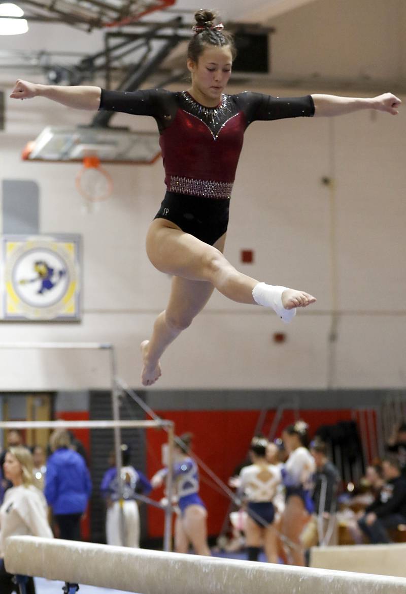 Prairie Ridge’s Nora Terhaar competes on the balance beam during the IHSA Mundelein Gymnastics Sectional on Feb. 13, 2025, at Mundelein High School.