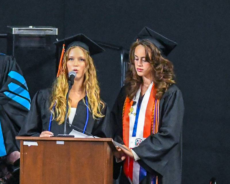 DeKalb High School seniors Emily Dooley and Amelie Grada Romero acknowledge School District 428 staff during the graduation ceremony on Saturday, May 23, 2026, held at the Convocation Center in DeKalb.