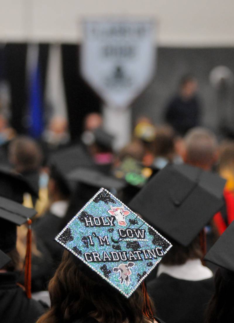 A graduate sports a decorated cap Saturday, May 21, 2022, during the McHenry High School 102nd Commencement Ceremony in the gym of the school’s Upper Campus. The ceremony was moved inside and split into two ceremonies because of the rainy weather.