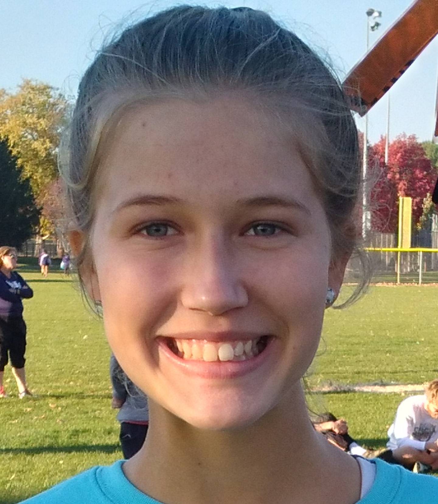 Princeton senior Lexi Bohms holds the all important parking pass for Saturday's IHSA State Cross Country Meet in Peoria. She punched a return ticket by finishing as the 10th and final individual qualifier from the Oregon Sectional.