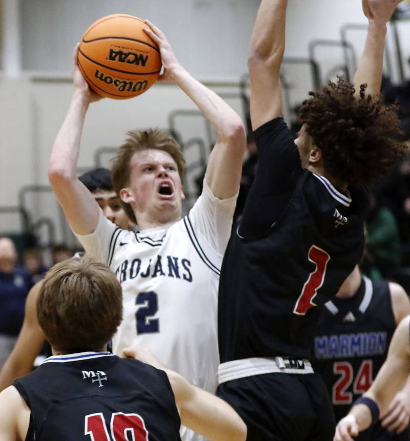 Cary-Grove's AJ Berndt drives to the basket agains tMarmion's Caden Anderson during an IHSA Class 3A Crystal Lake South Regional boys basketball semifinal game on Wednesday, February, 25, 2026, at Crystal Lake South High School.