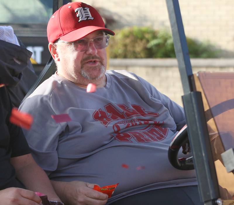 Hall head football coach Randy Tieman hands out candy during the Hall High School Homecoming parade on Thursday, Sept. 28, 2023 in Spring Valley.
