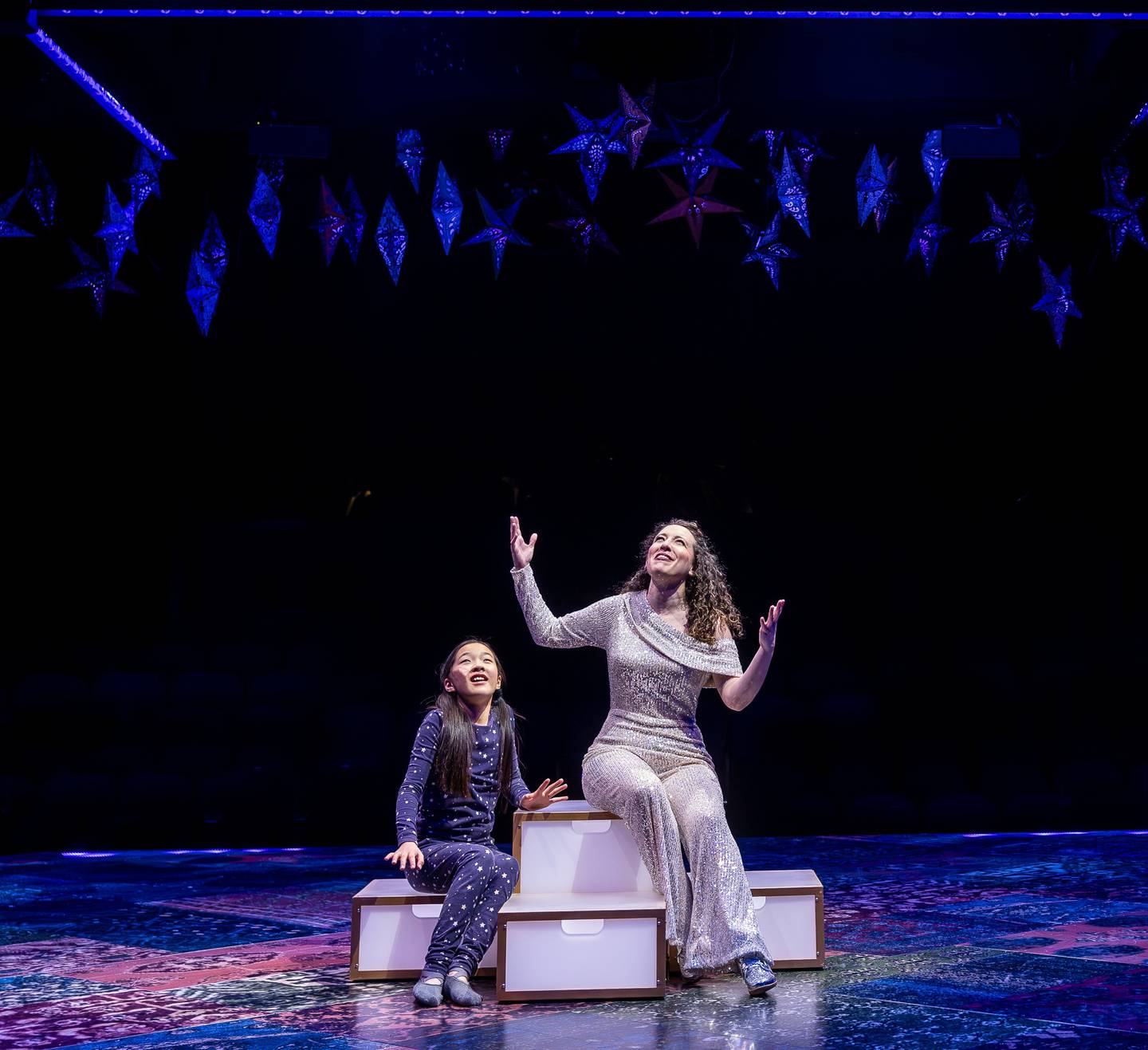 Chicagoland’s longest running musical theatre, Marriott Theatre, officially kicks off its spectacular 50th Anniversary Season with one of the most enduring and beloved musicals of all time, Joseph and the Amazing Technicolor Dreamcoat, through March 30, 2025. Kaitlyn Davis plays mother and Narrator & Avelyn Lena Choi alternates in role of her child.