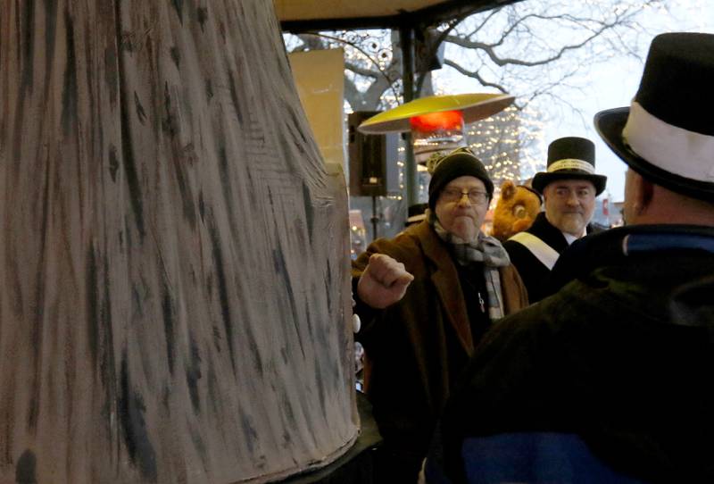 Stephen Tobolowsky who played "Ned Ryerson" in the movie "Groundhog Day" knocks to wake up Woodstock Willie  on Sunday, Feb. 2, 2025, so he can make his annual Groundhog Day Prognostication in the Woodstock Square.