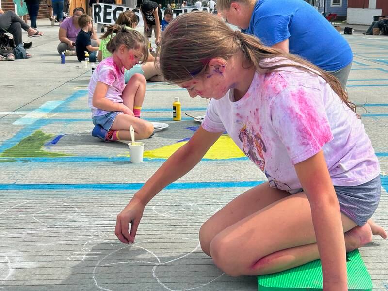 Brinkley Icenogle, 11, of Morrison, foreground, paints a sports scene Saturday at Paint the Town, while her sister, Emery Icenogle, 6, works in her own square alongside their mother, Karen.