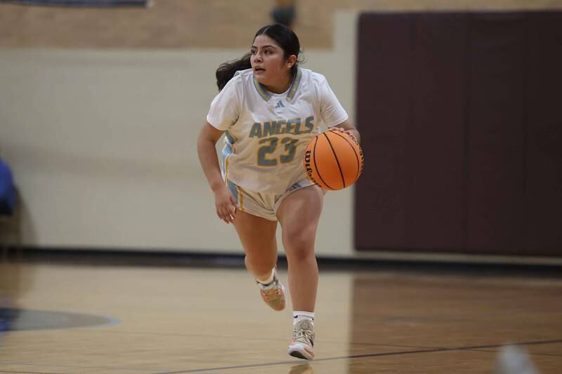 Joliet Catholic’s Breanna Zafra works the ball upcourt against Marian Catholic on Monday, Dec. 9, 2024 in Joliet.