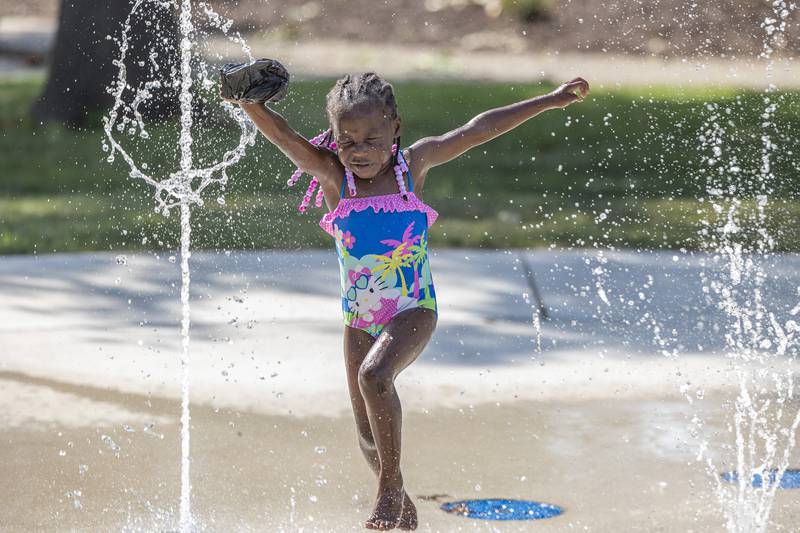 Yana Jones, 4, runs through the water at the Sterling splash pad Wednesday, August 23, 2023. Temps will continue to cool off over the several days.