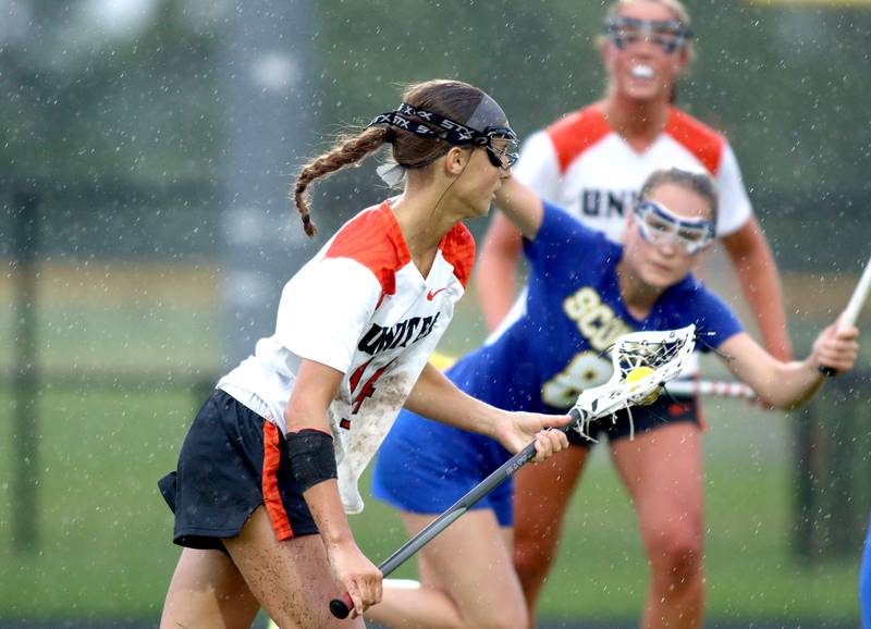 Crystal Lake Central’s Addison Bechler moves the ball against Lake Forest during girls lacrosse supersectional action at Metcalf Field on the campus of Crystal Lake Central Tuesday.
