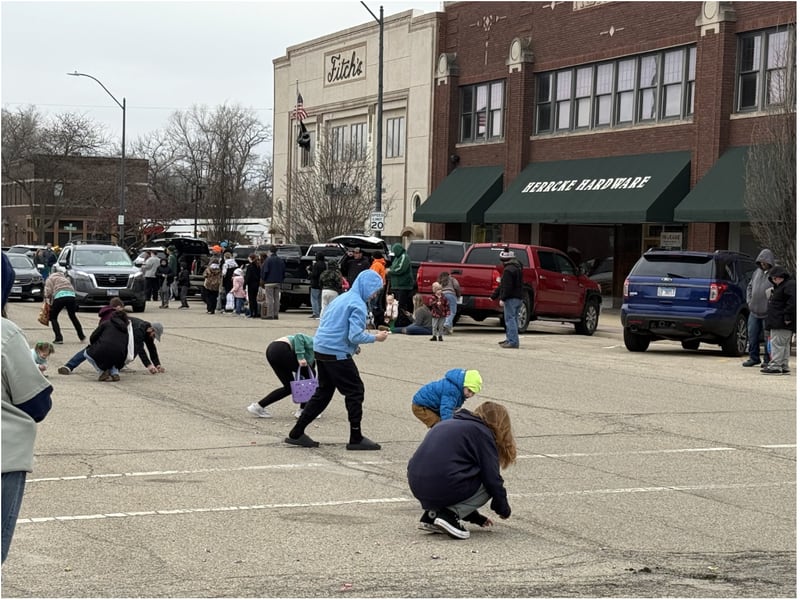 Kids at the La Salle St. Patrick's Parade race to pick up candy thrown from the passing parade vehicles.