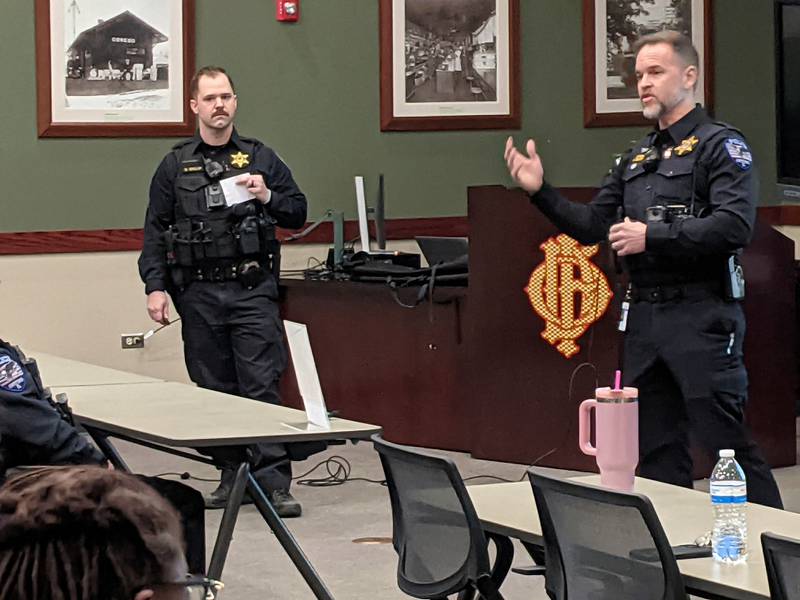 Oswego Police Sgt. Matt Gallup, left, and Oswego Police Chief Jason Bastin, right, talk to community stakeholders Jan. 14 about the department's new community engagement unit. Gallup will supervise the members of the new unit.