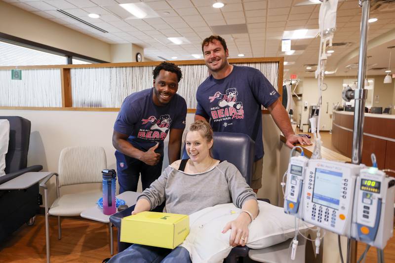 Chicago Bears linebacker Amen Ogbongmiga (45) and center Drew Dalman (52) deliver Lemons of Love care packages to cancer patients at Advocate Infusion Center on Oct. 21 in Libertyville.