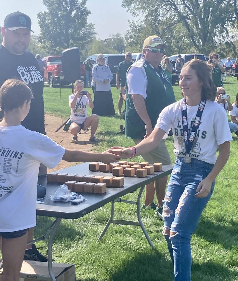 Emma Slingsby receives her state championship ring at Abbot Philip Davey Field Saturday.