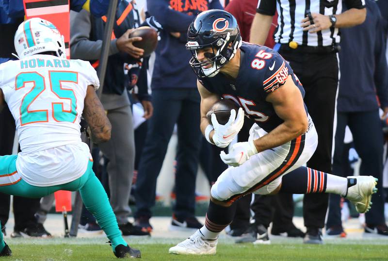Chicago Bears tight end Cole Kmet prepares for contact with Miami Dolphins cornerback Xavien Howard during their game Sunday, Nov. 6, 2022, at Soldier Field in Chicago.