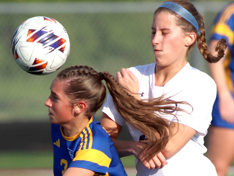 Johnsburg’s Charlie Eastland, left, battles North Shore Country Day’s Alana Duffield for the ball  in IHSA Class 1A Sectional Title Game action at Richmond-Burton High School in Richmond on Tuesday, May 27, 2025.