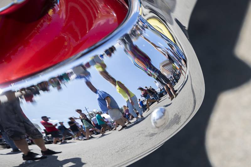 Chromed auto parts throw off distorted reflections Sunday, August 27, 2023 at the Amboy Depot Days car show.