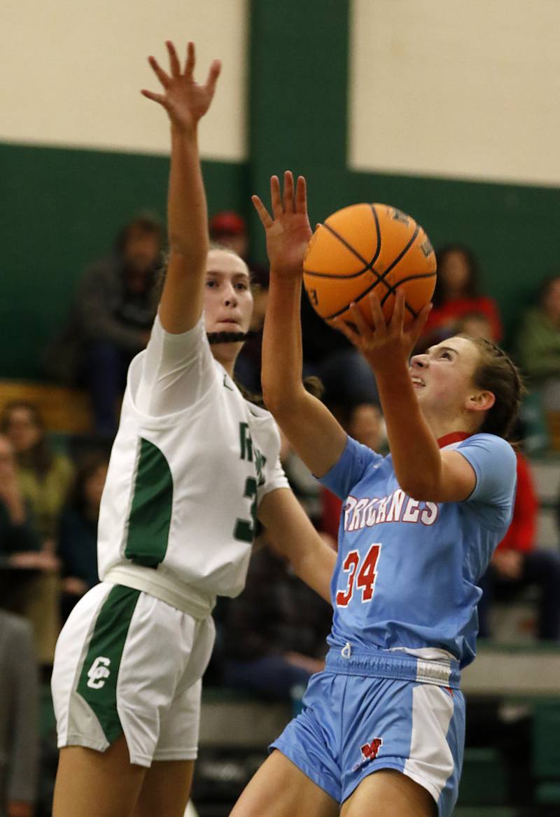 Marian Central's Juliette Huff drives to the basket against Grayslake Central's Peyton Hoffmann during a nonconference girls basketball on Monday, Jan. 13, 2025, at Grayslake Central High School.