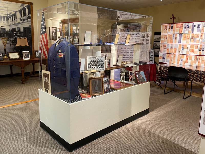 A display showing uniforms and items belonging to Terry Thompson and Pete Thomson inside the Ottawa Scouting and Heritage Museum.