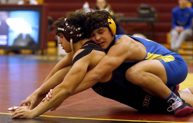 Johnsburg's Duke Mays controls Richmond-Burton's Dominick Dickens during the 165-pound match of a Kishwaukee River Conference wrestling match on Thursday, Jan. 25, 2024, at Richmond-Burton High School.