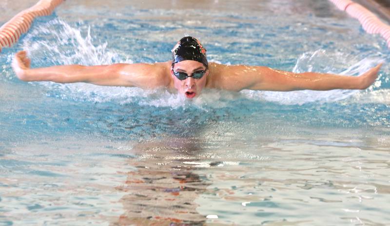 Tim Braun, a senior, swims the butterfly during DeKalb-Sycamore co-op boys swimming practice Monday at Huntley Middle School in DeKalb.
