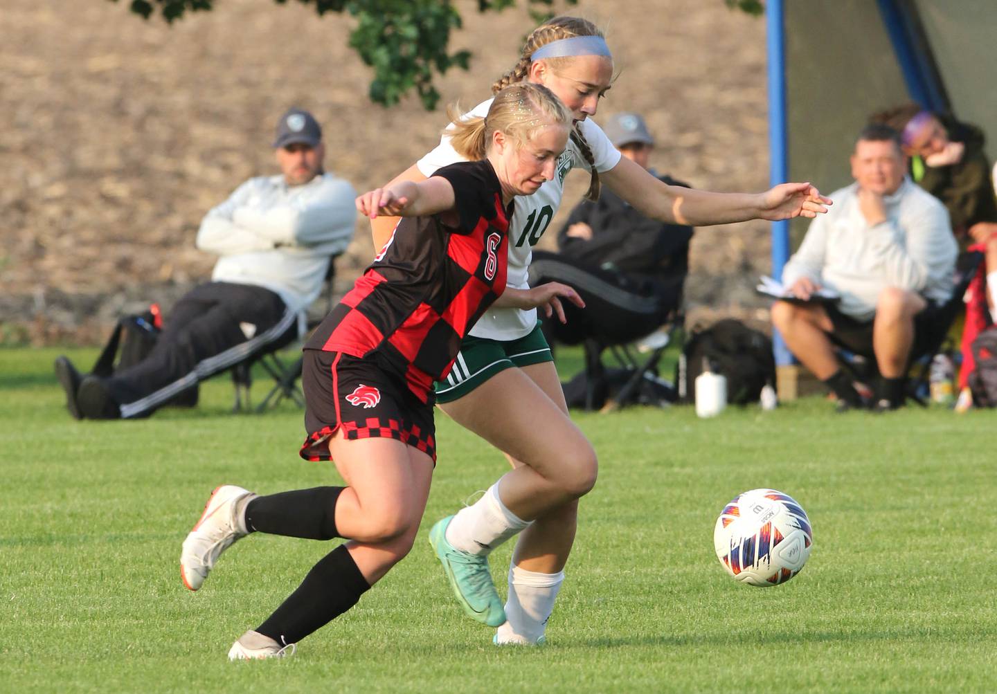 Indian Creek's Jolee Larson and Alleman's Carson Wendt go after the ball during their Class 1A sectional final game Friday, May 19, 2023, at Hinckley-Big Rock High School.