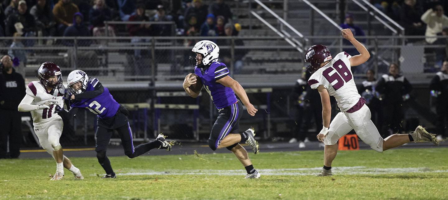 Dixon’s Landon Knigge heads for the endzone on a 57 yard run against Marengo Friday, Nov. 1, 2024 in the 4A football playoffs in Dixon.