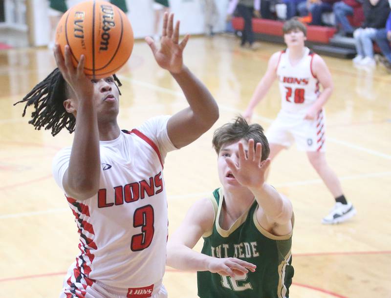 LaMoille's Cody Winn eyes the hoop as St. Bede's Carson Riva defends on Tuesday, Feb. 11, 2025 at LaMoille High School.