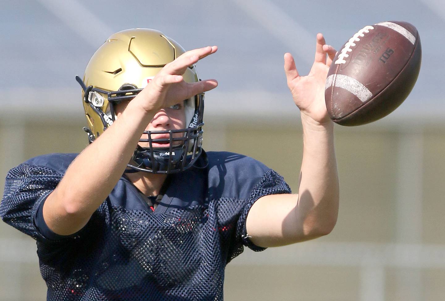 Hiawatha quarterback Chris Korb takes a snap during practice Monday, Aug. 16, 2021 at the school.